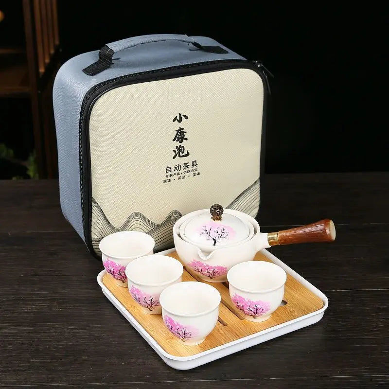 Ceramic teapot with cherry blossom decoration and rotating strainer